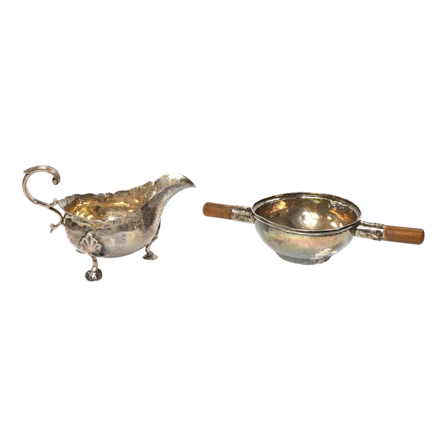 A Victorian silver sauce boat, London, 1876, length 14.2cm and metal quaich (adapted). Condition - poor to fair